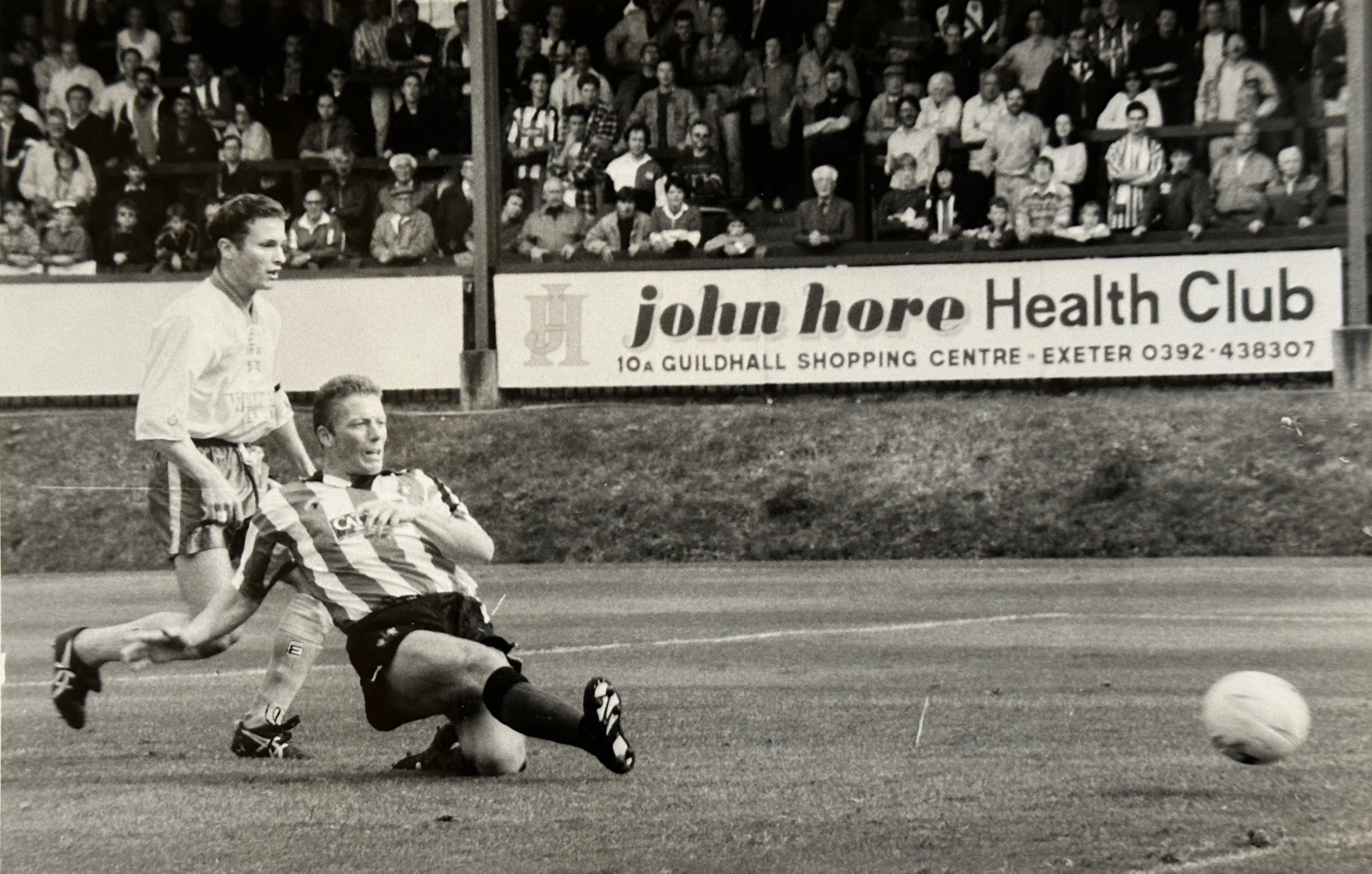 Ronnie Jepson scoring for Exeter against Wrexham in 1993. The image is in black and white. 