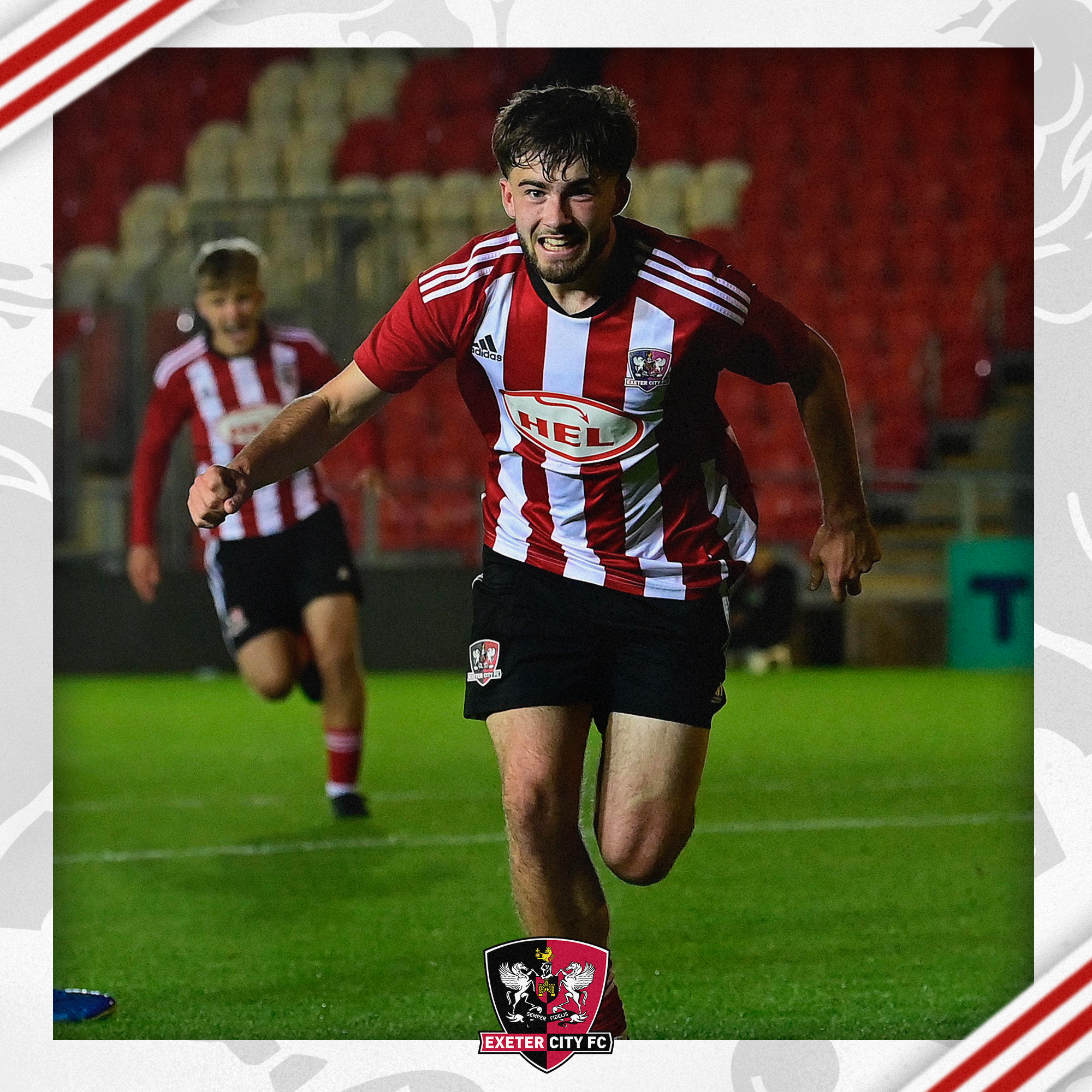 Theo Cutler running towards the camera in celebration after his goal.