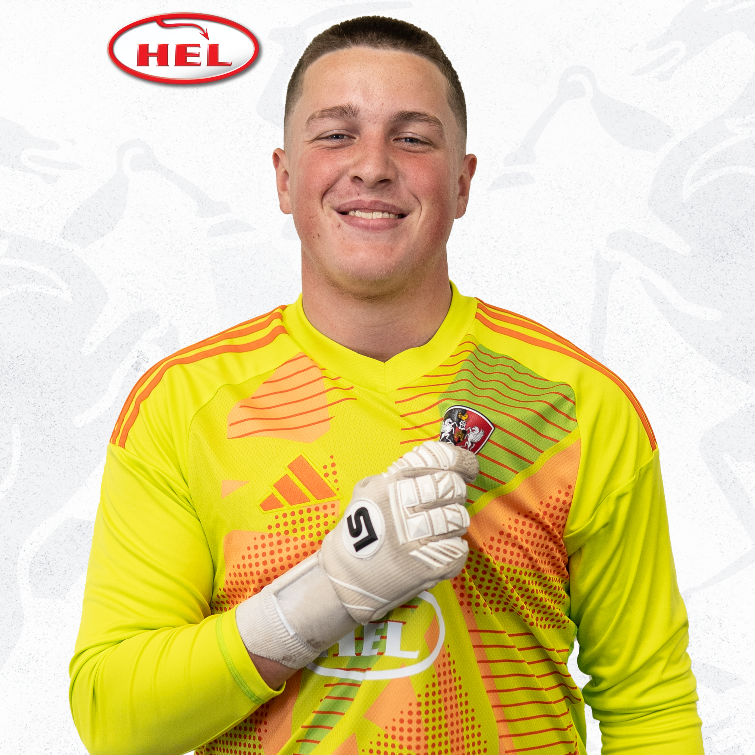 Under-18s player profile picture of Dan Layer. He's wearing the bright yellow and orange goalkeeper kit, and with his gloved hand he's holding the Exeter City badge. The hel logo is in the corner.