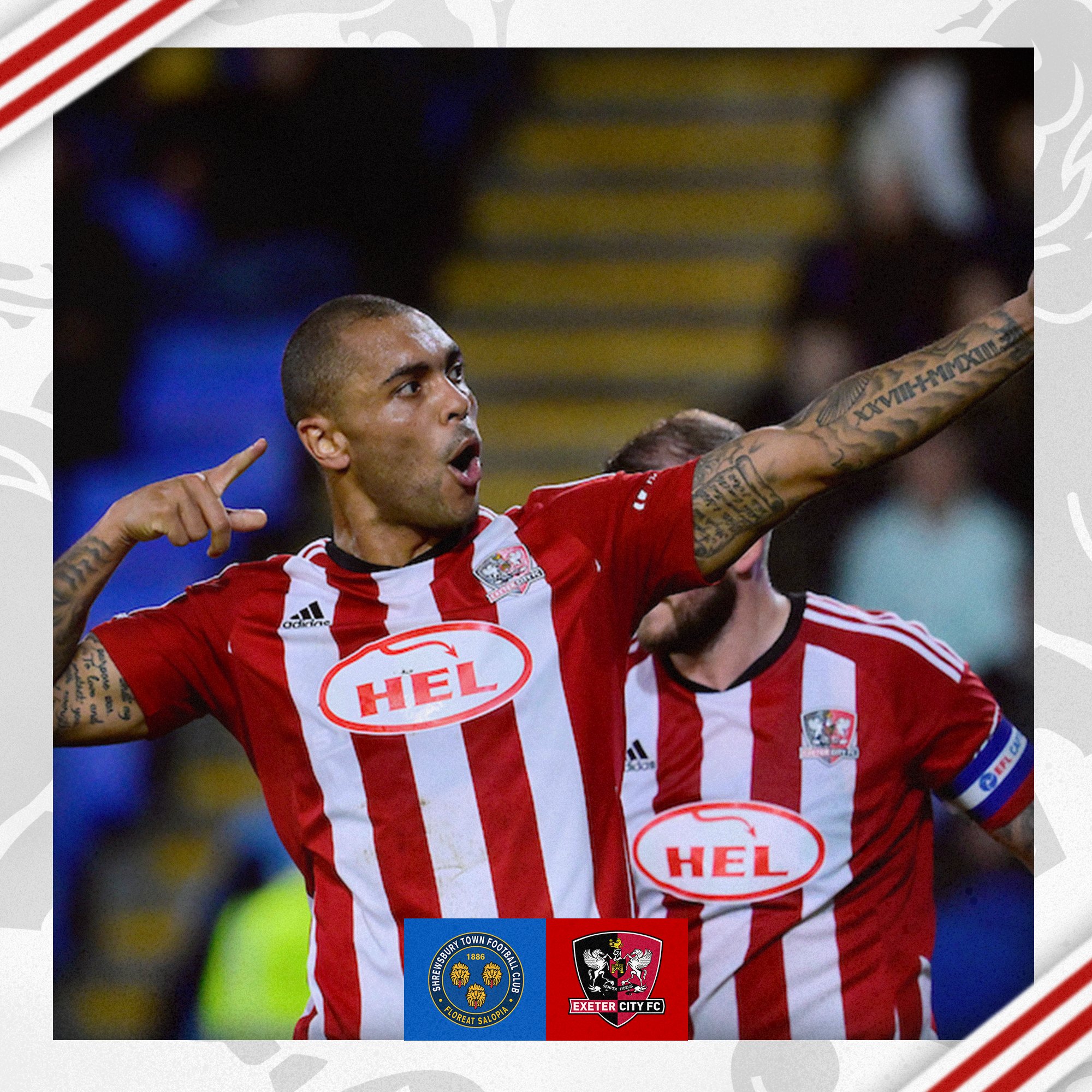 Josh Magennis, in his red and white home kit, celebrating City's second goal by pretending to point a bow and arrow at the away end. 