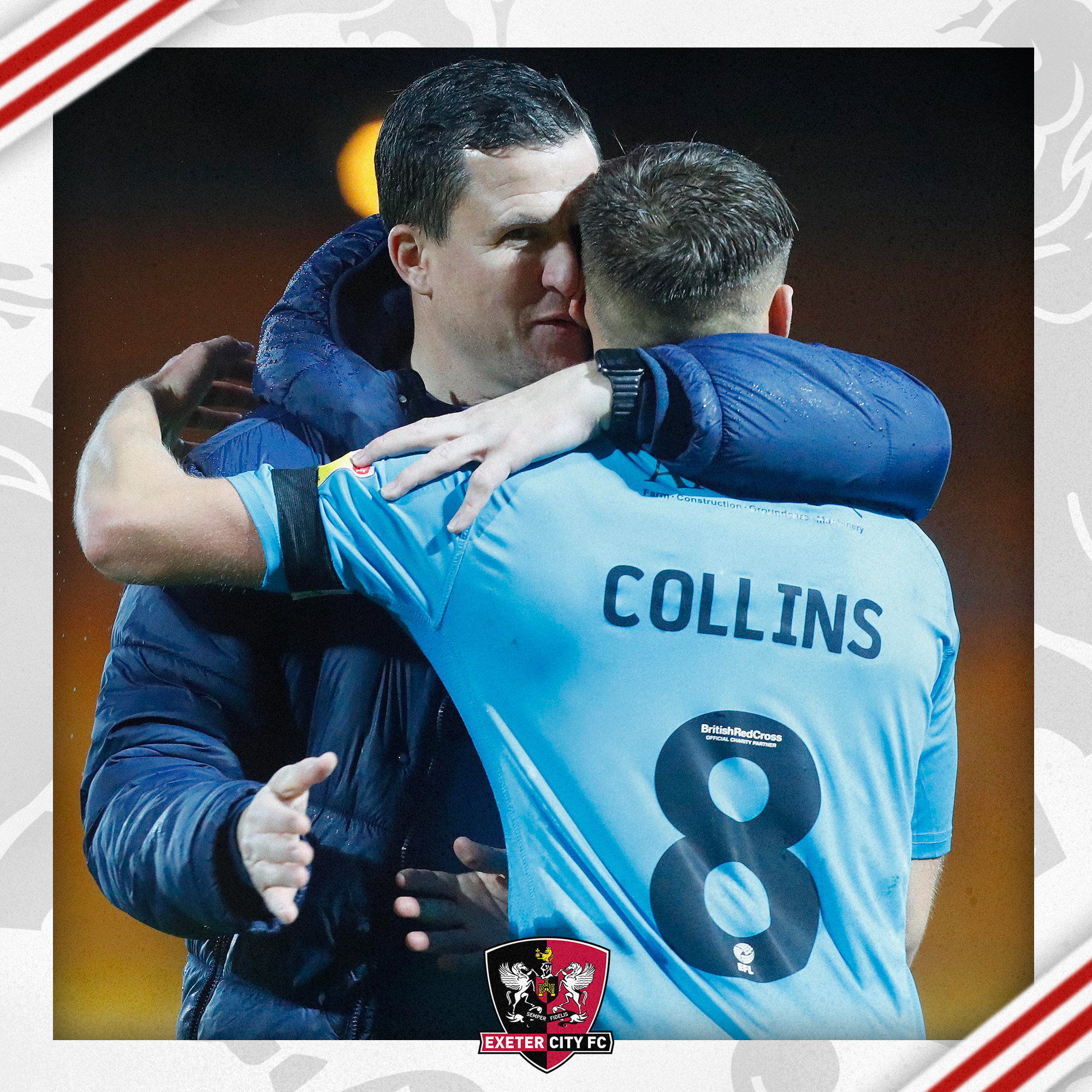 Gary Caldwell hugging Archie Collins after he scores against Port Vale. Archie is facing away from the camera so you can see 'COLLINS 8' and he is in the blue third away from that season.