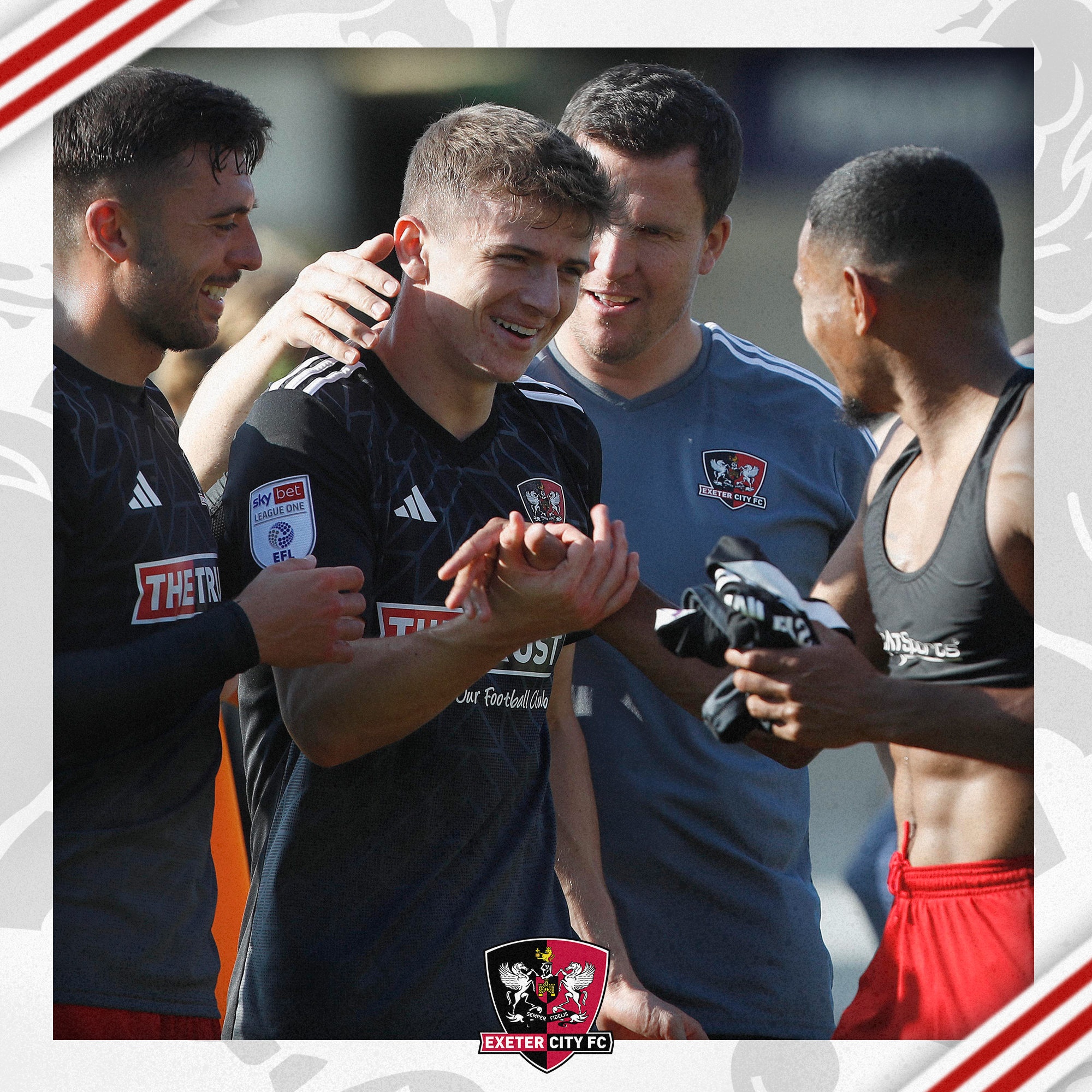 Gary Caldwell congratulating Ryan Trevitt after his winning goal against Burton Albion. Also present in the frame on the right is Reece Cole, and the left is Demetri Mitchell.