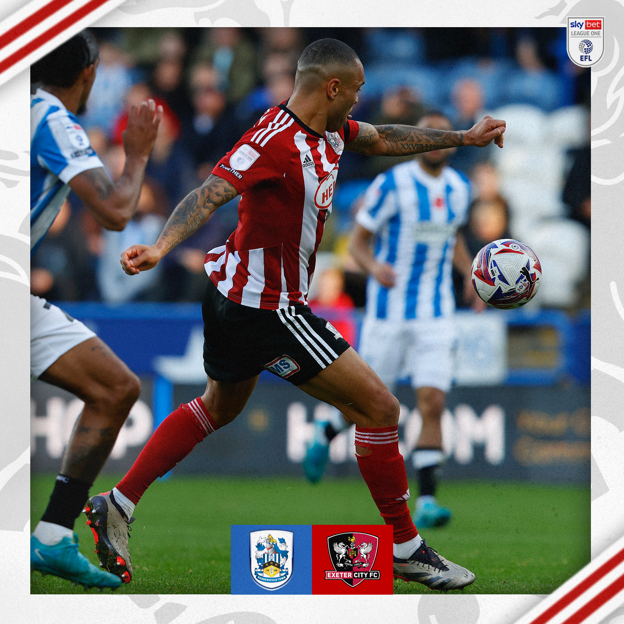 Josh Magennis, wearing his red and white home shirt, lining up to take a shot. The ball is in the air and his foot is back, ready to swing at it.