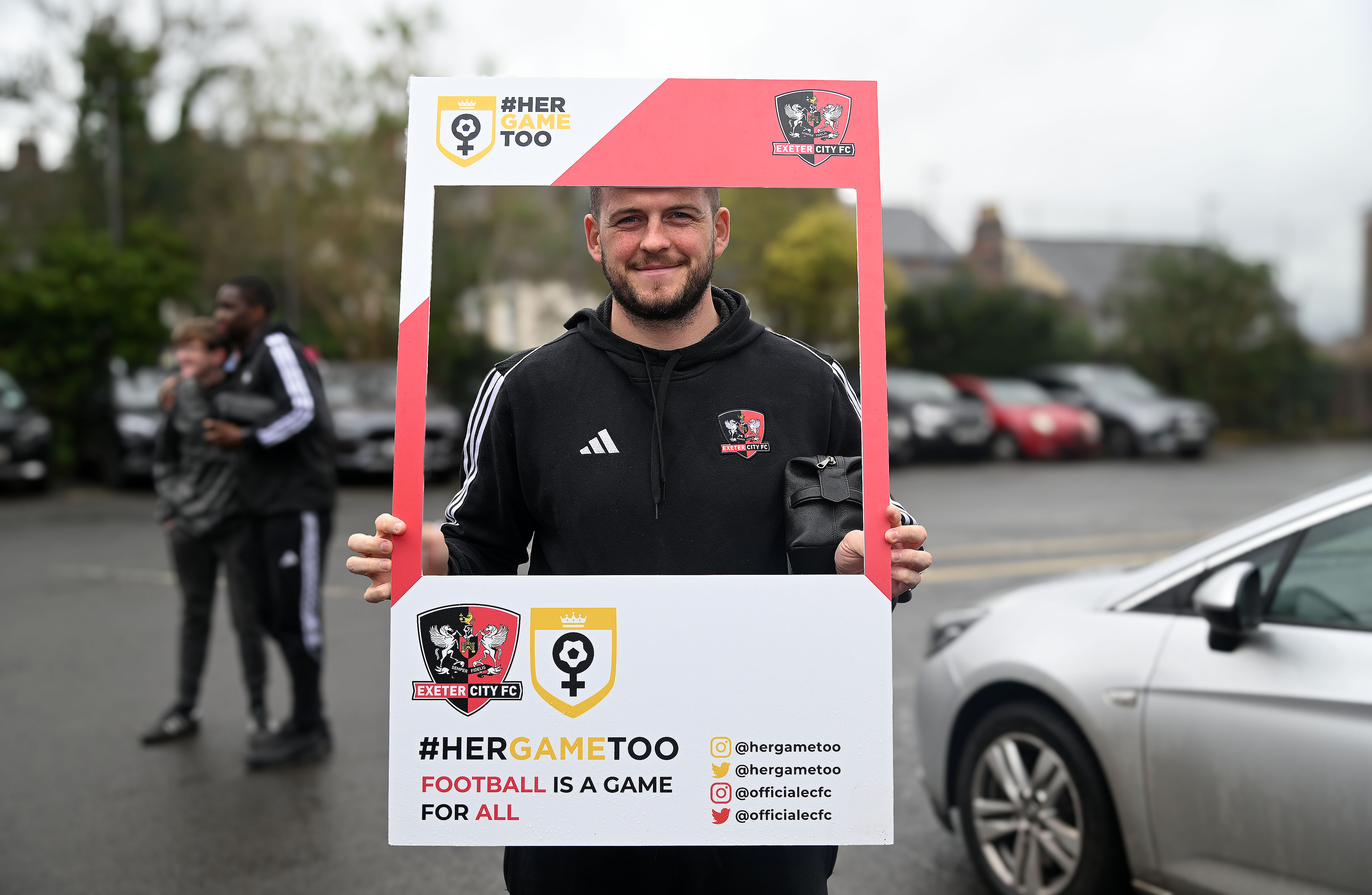 Pierce Sweeney holding the #HerGameToo cardboard square cut out before a matchday at St James Park last season.