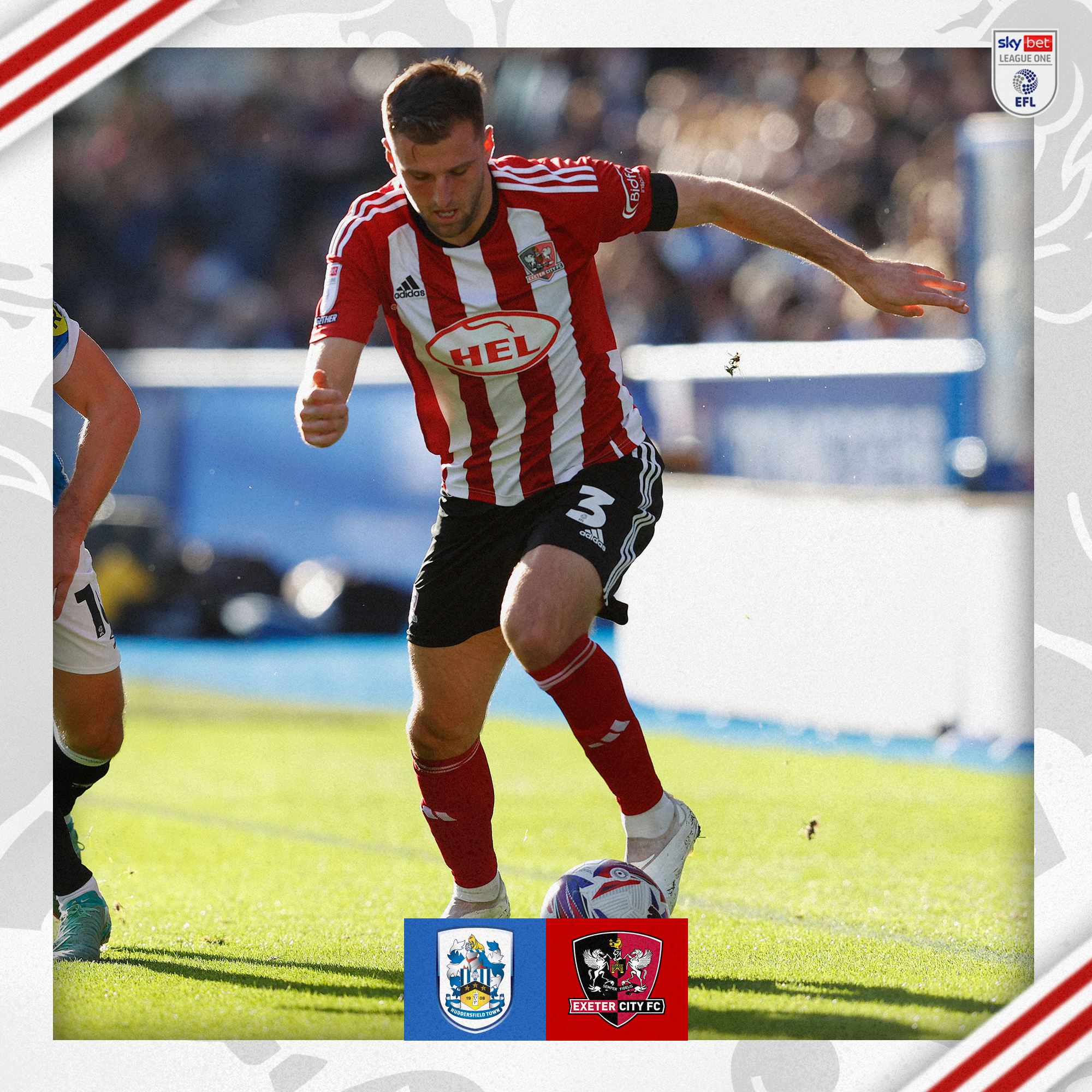 Ben Purrington, in his red and white home kit, running with the ball.