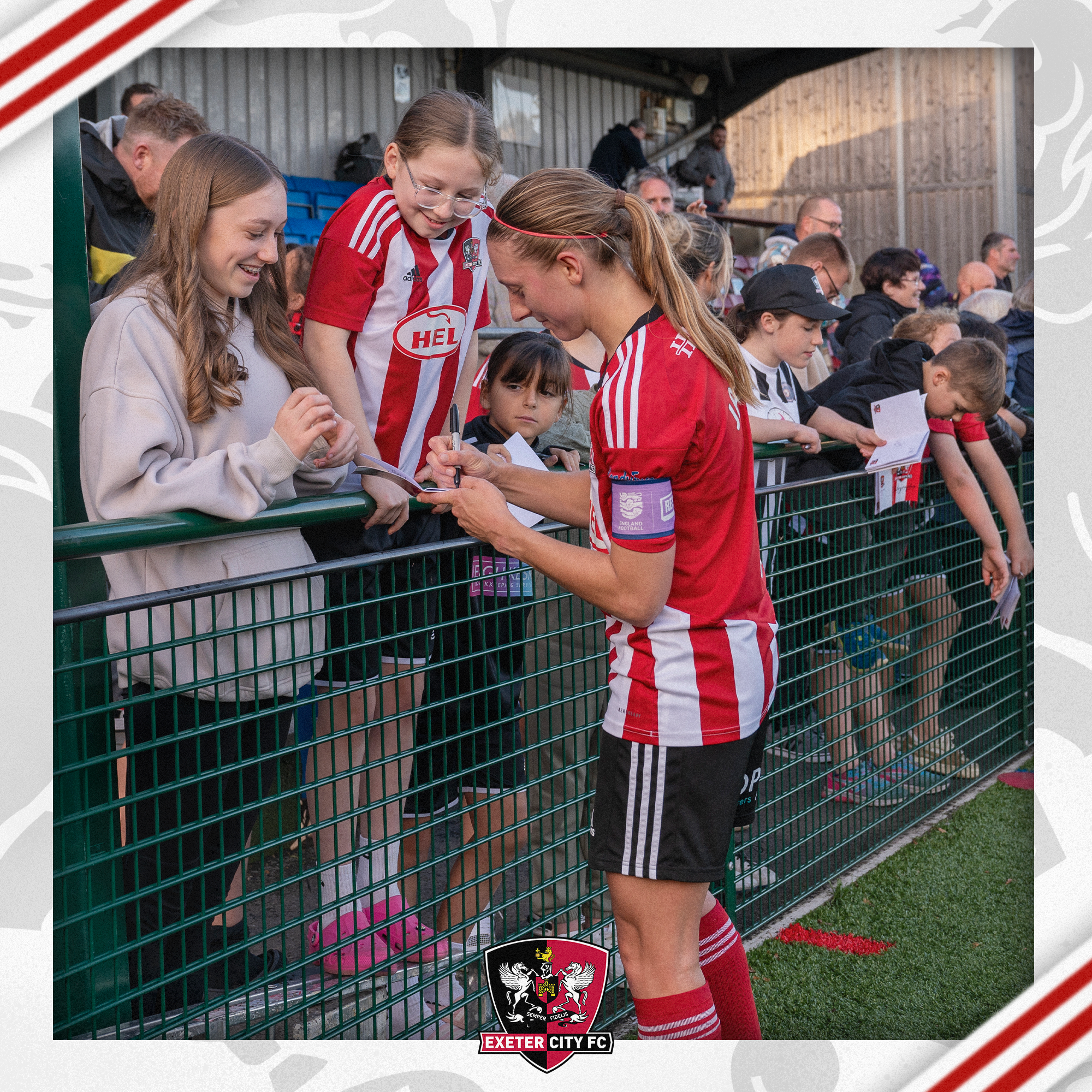 Image of Exeter City captain, Bow Jackson, signing autographs at Coach Road