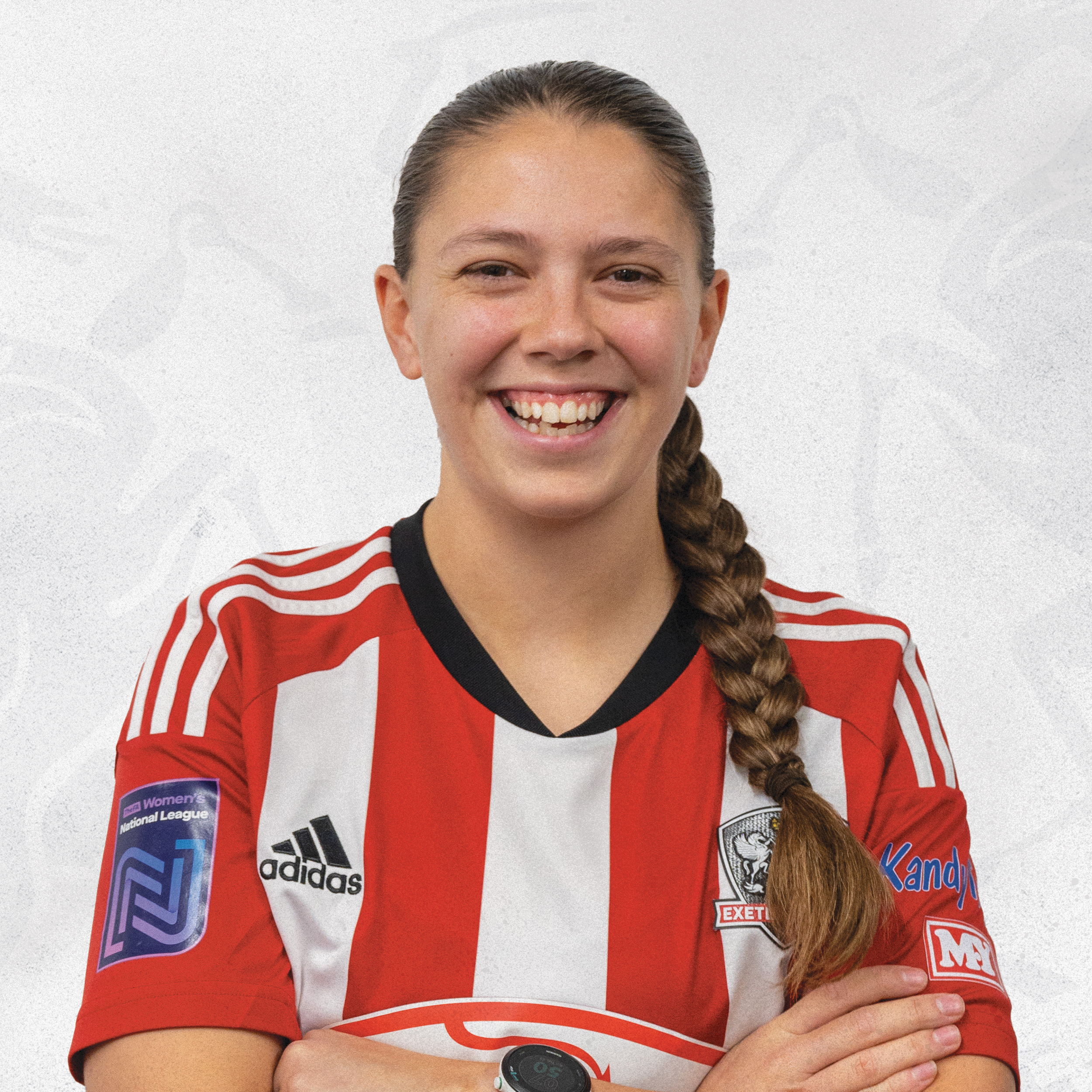 Profile image of Bronwyn Cousins, in her red and white home shirt for Exeter City Women