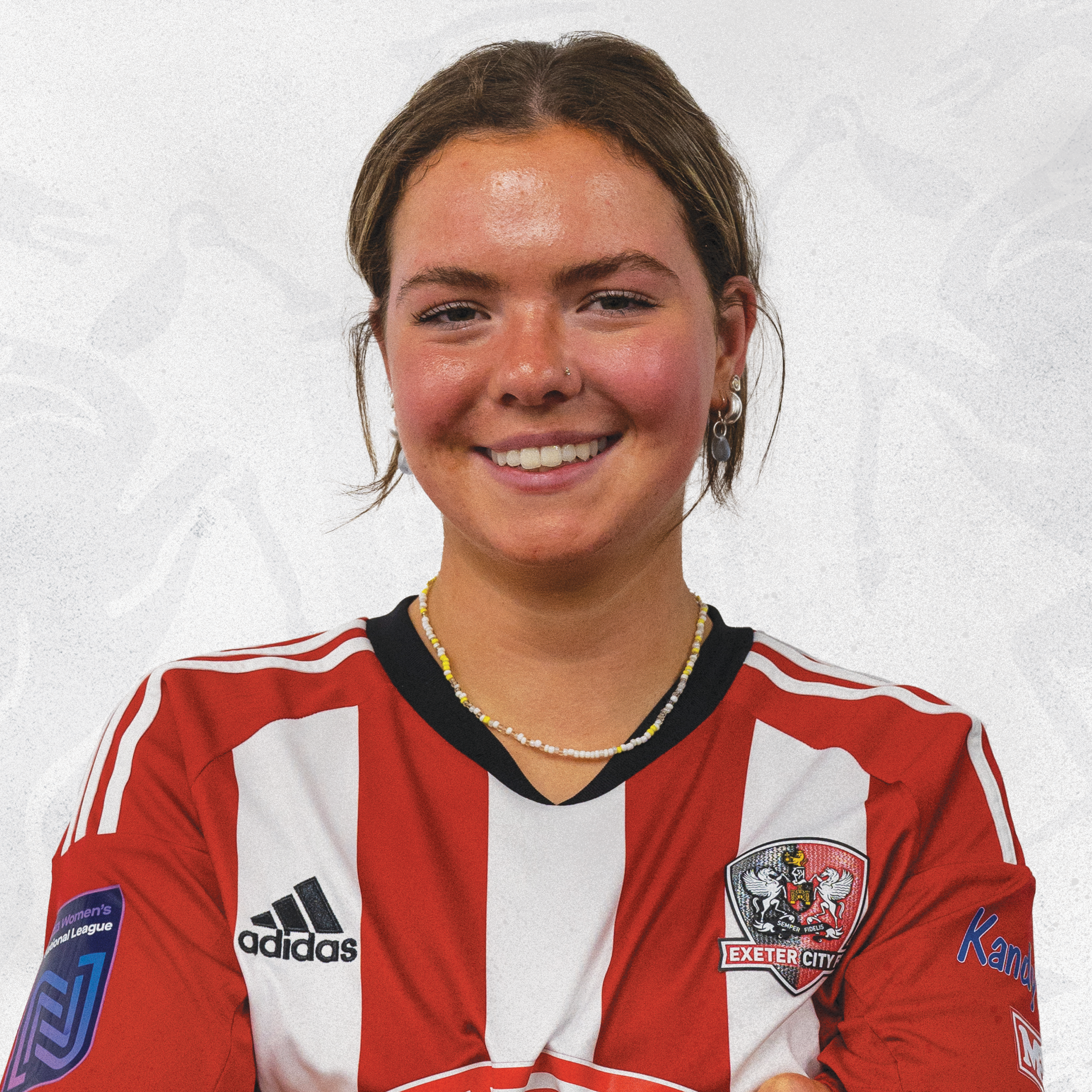 Jess Cockayne profile image in her red and white home shirt