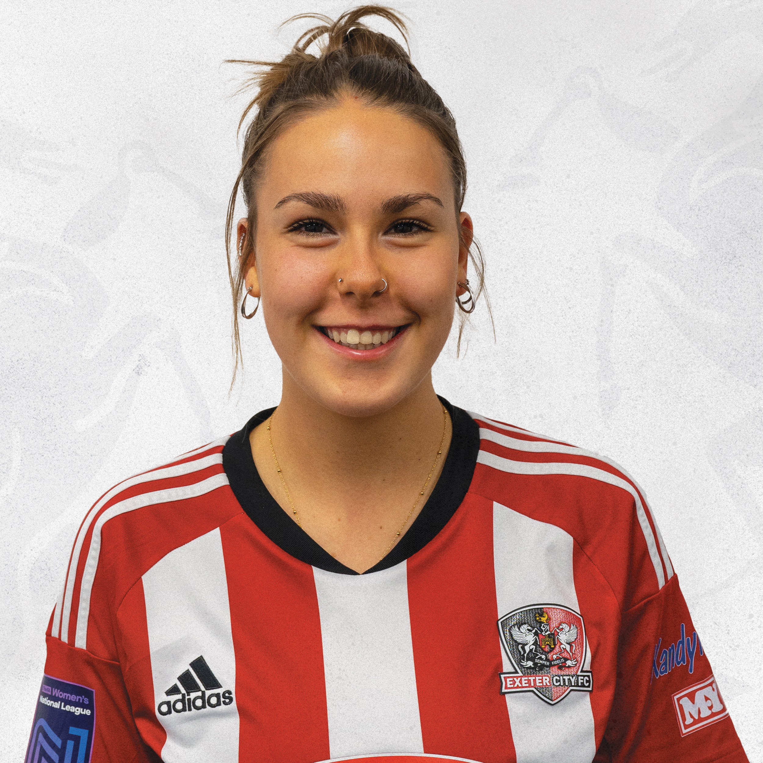 Profile picture of Maddie Brandon in her red and white home kit