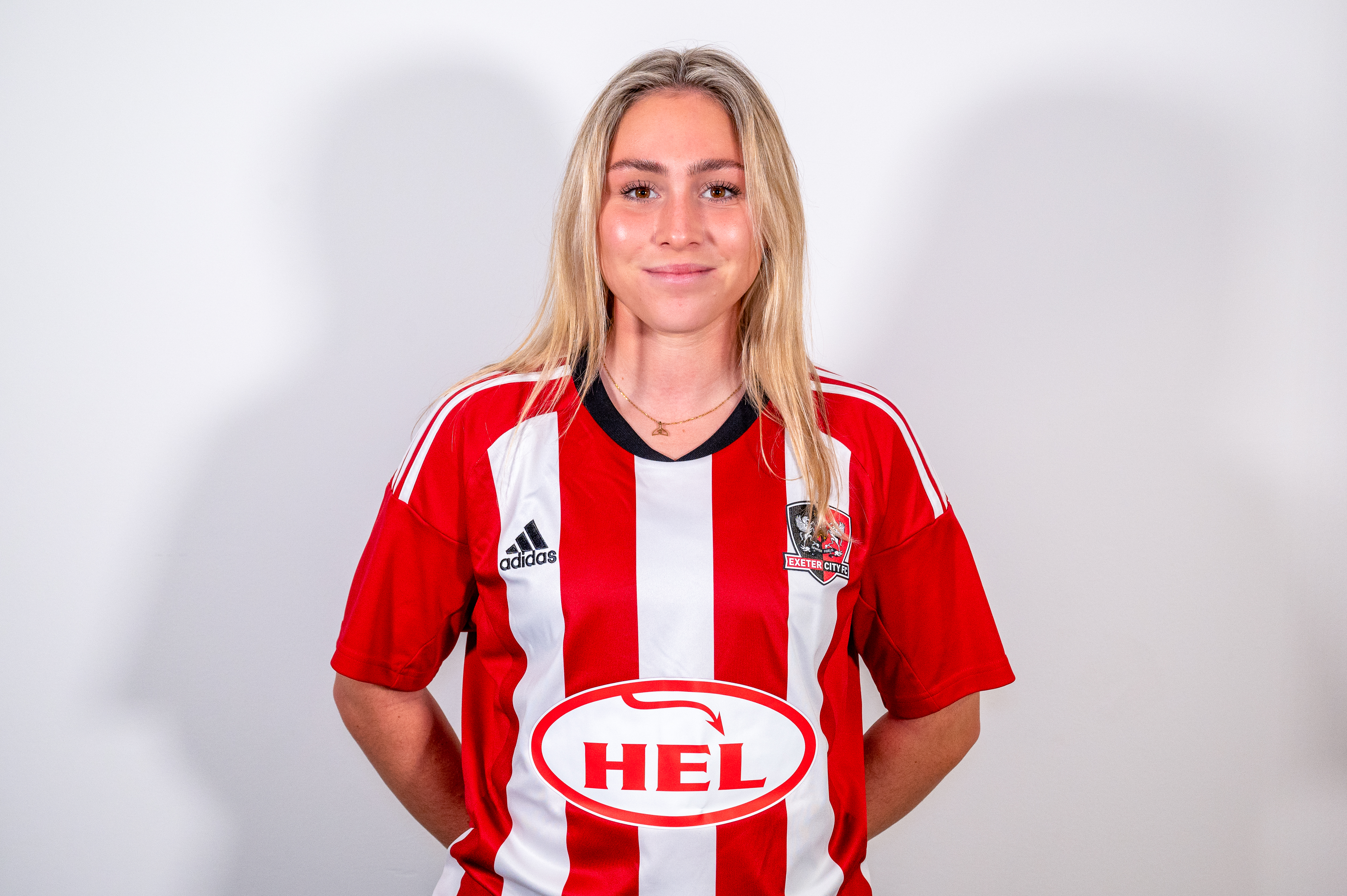 Profile image of Maya Kendall, Exeter City Women player in her home kit, standing straight on while looking at the camera.