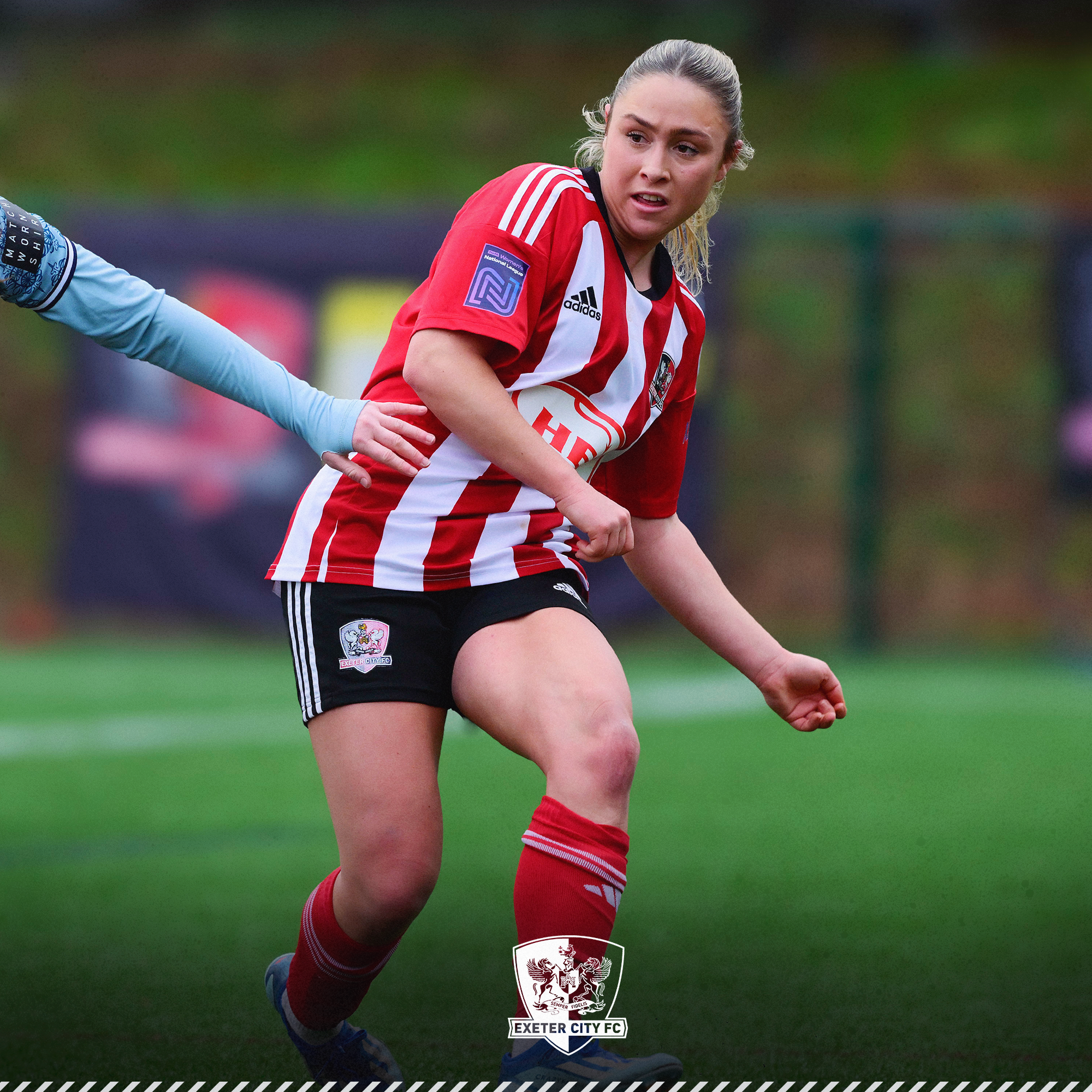 Image of Maya Kendell playing For Exeter City Women in her red and white home strip