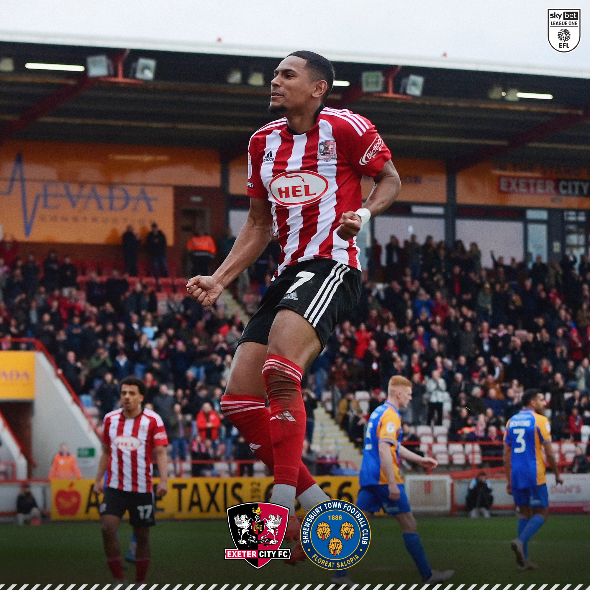 Demetri Mitchell jumping in the air in front of the big bank to celebrate his goal