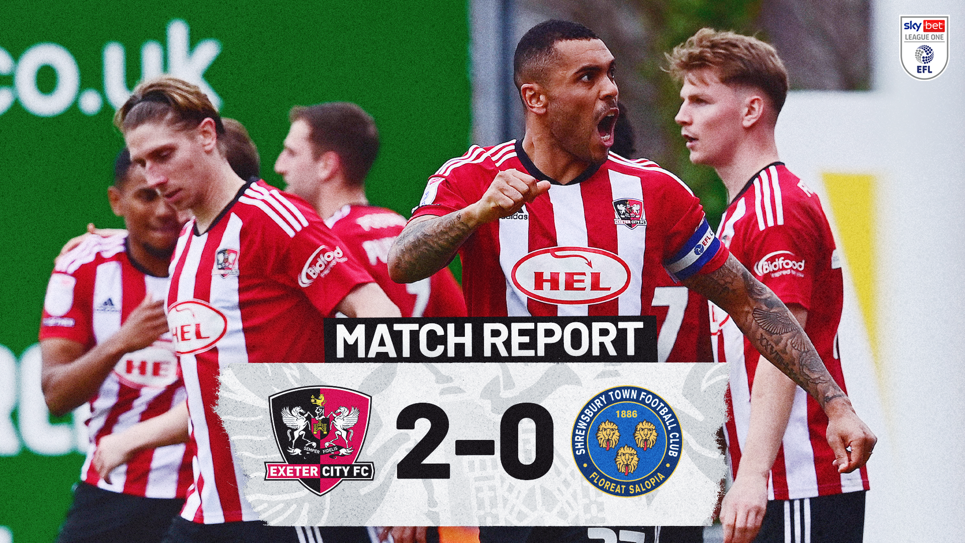 Match report graphic for Exeter City 2 Shrewsbury Town 0. The image shows the players celebrating the second goal in front of the Big Bank, with Josh Magennis shouting and clenching his fist.