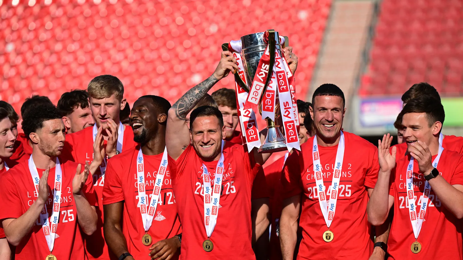 Billy Sharp holding Doncaster's League Two Trophy