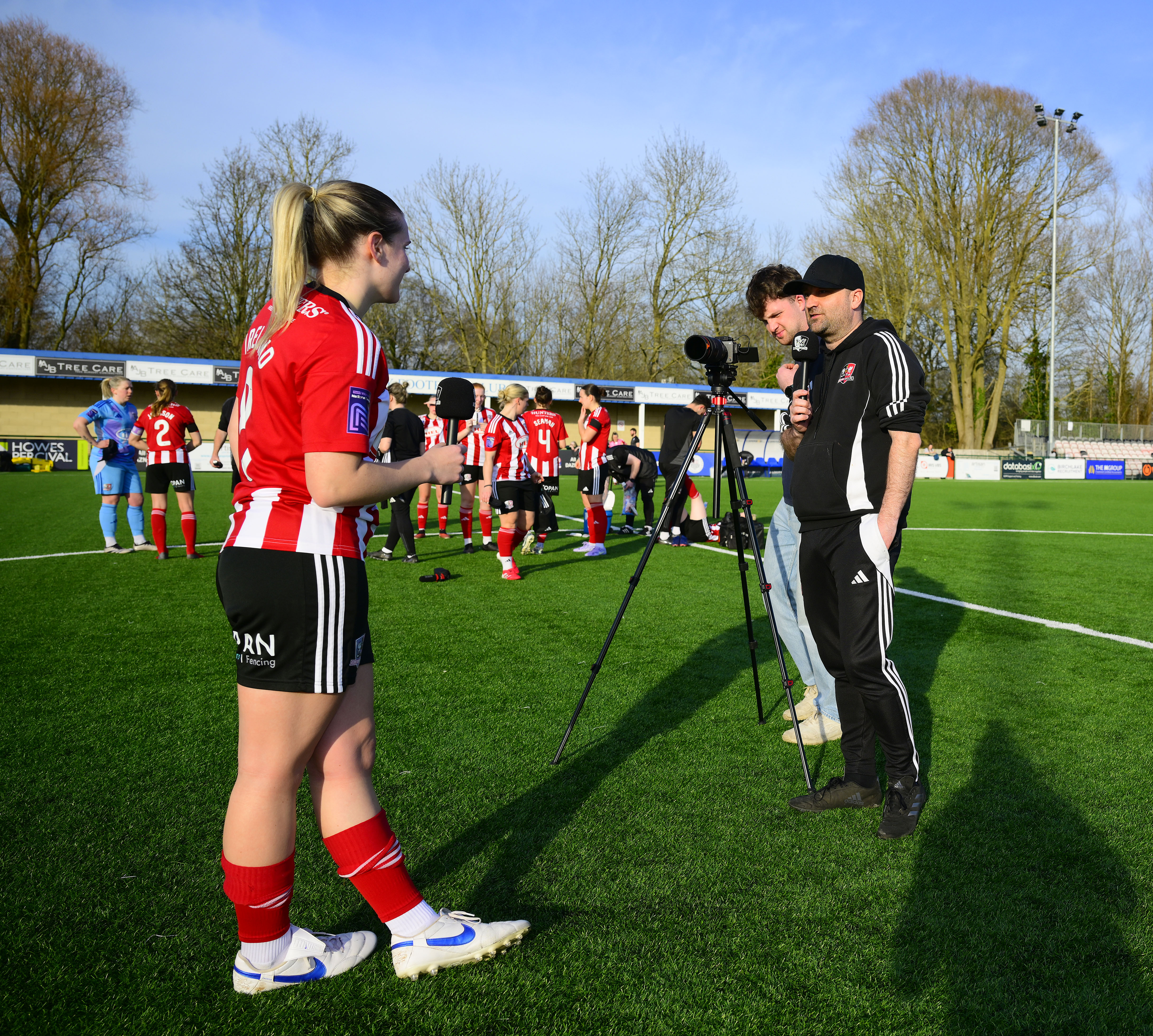 Image of Beth Ireland being interviewed at an Exeter City Women match