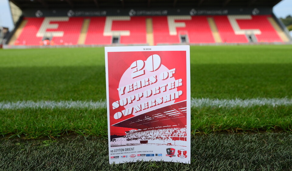 Image of an ECFC programme on the stadium pitch