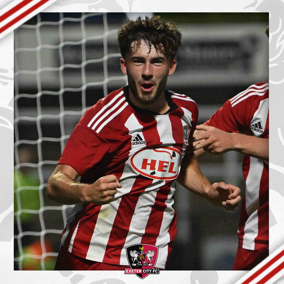 Theo Cutler celebrating against Bromley in Exeter City's red and white home kit.