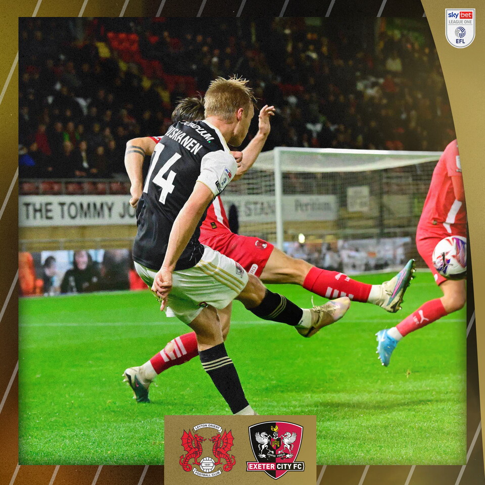 Ilmari Niskanen crossing the ball into the box with his back to the camera.