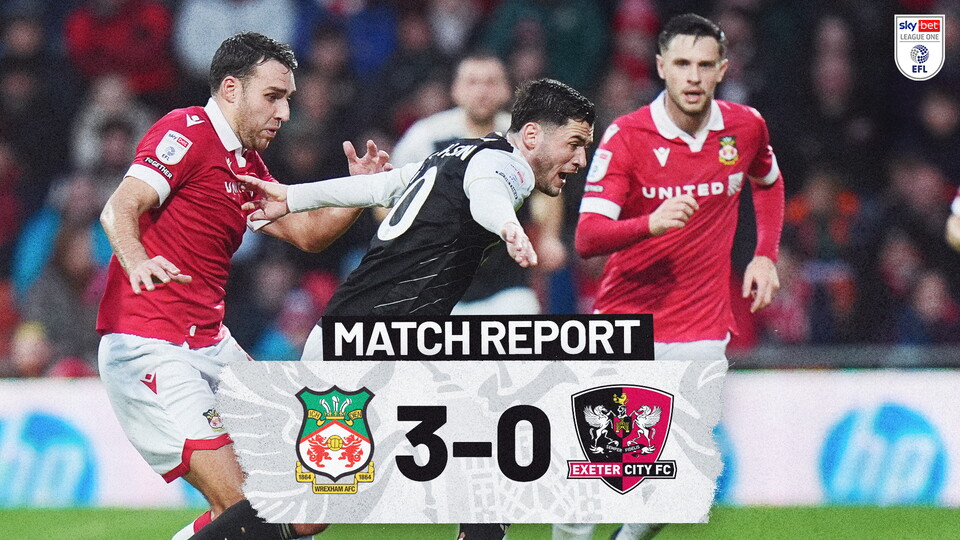 Match Report Graphic for Wrexham 3-0 Exeter City. Image shows Jack Aitchison trying to run away from his marker on the ball.