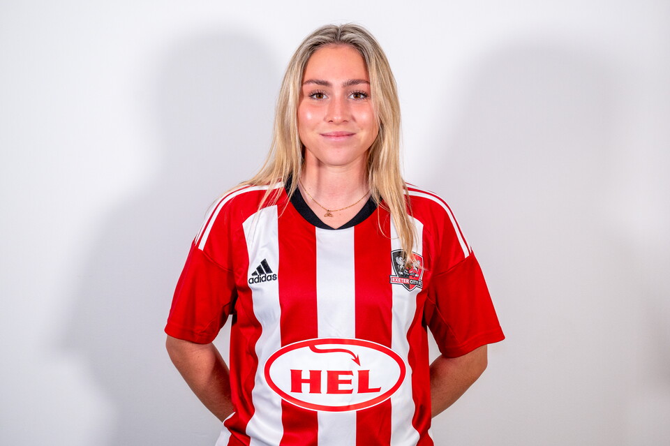 Profile image of Maya Kendall, Exeter City Women player in her home kit, standing straight on while looking at the camera.