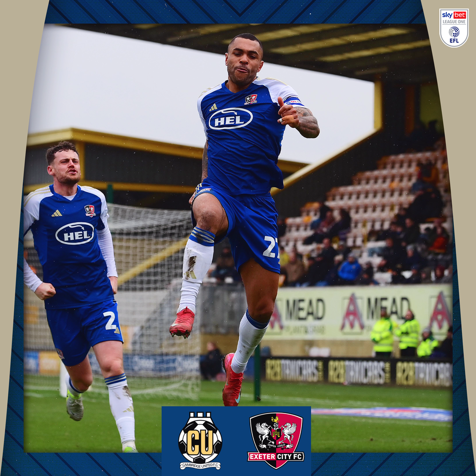 Josh Magennis celebrating his goal, by jumping towards the camera with his fist out