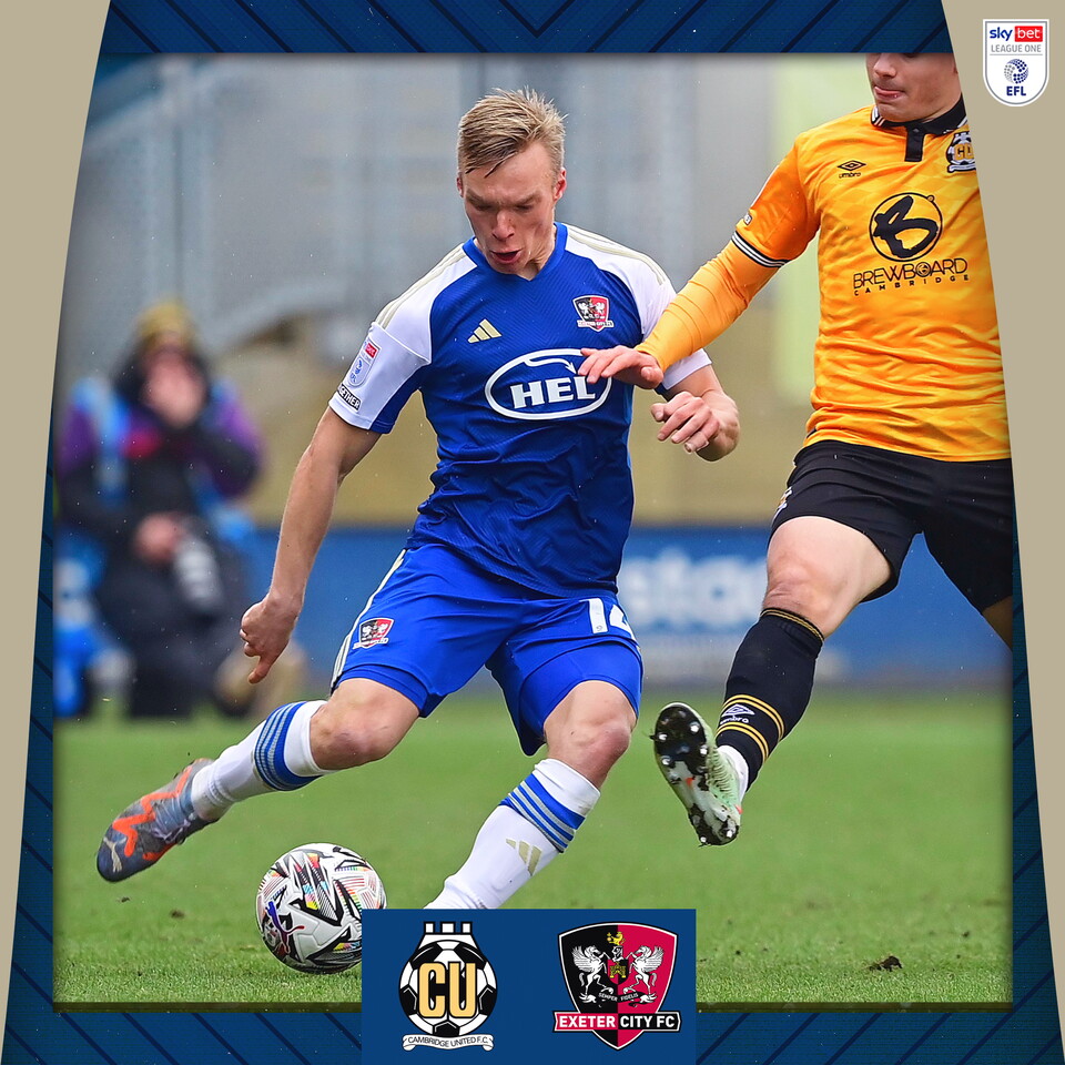 Ilmari Niskanen, in his blue away kit, sending a pass across field