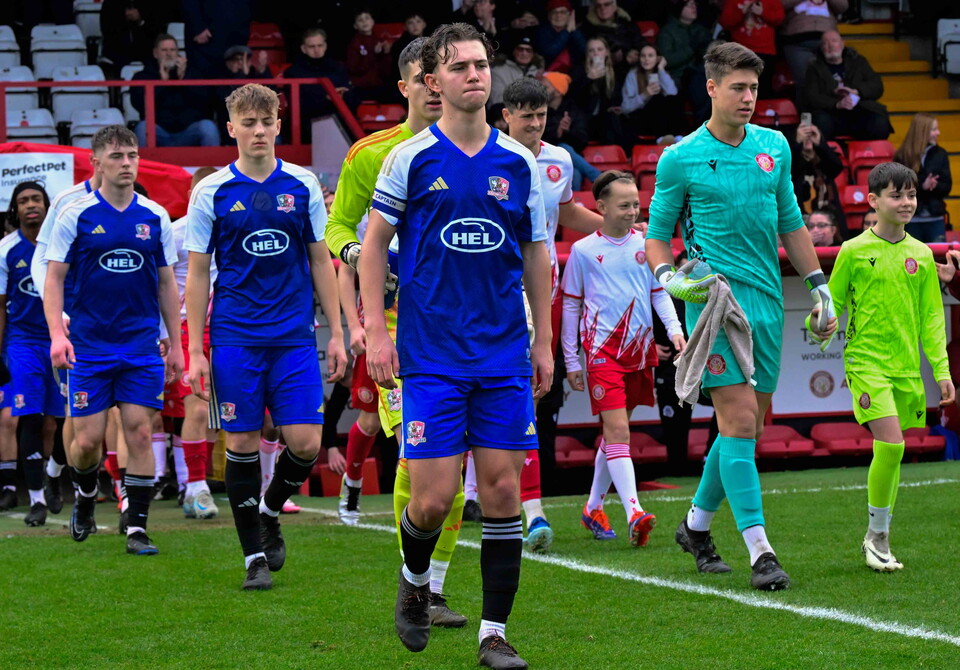Jacca Cavendish leading the team out against Stevenage U18