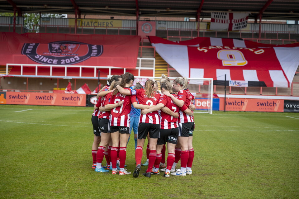 Team huddle image of Exeter City Women