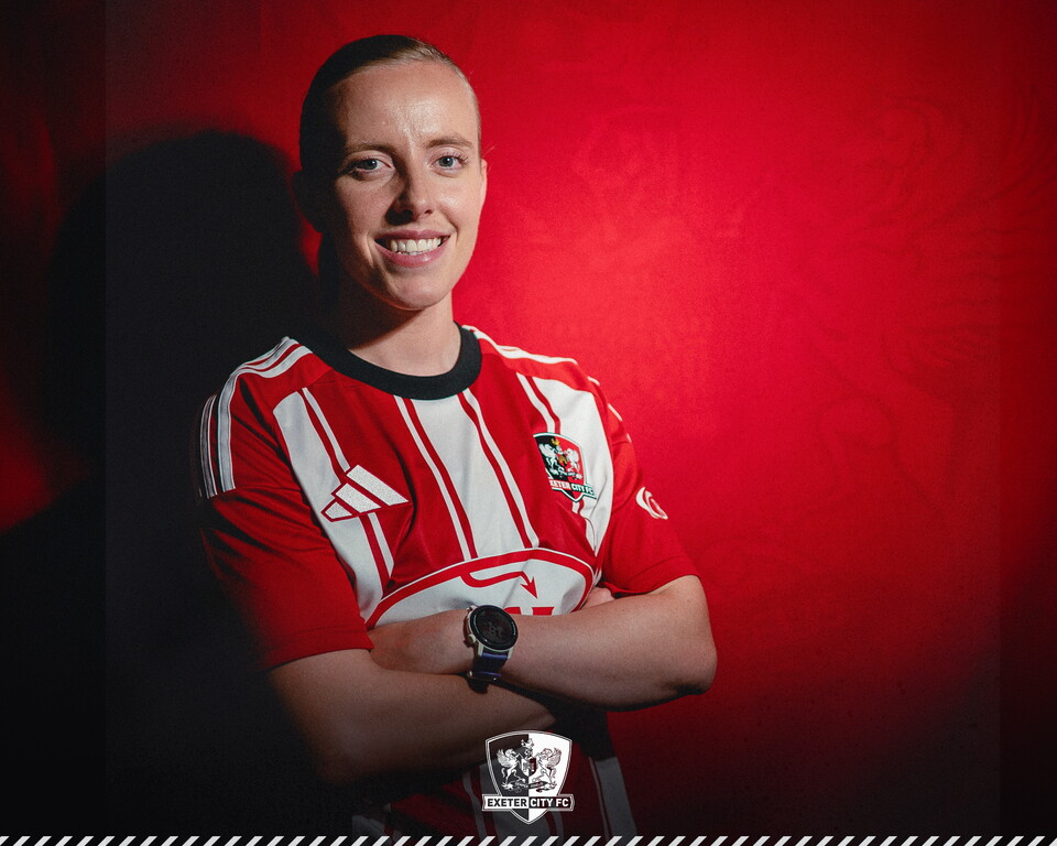 Image of Emily Poole with her arms crossed looking at at the camera