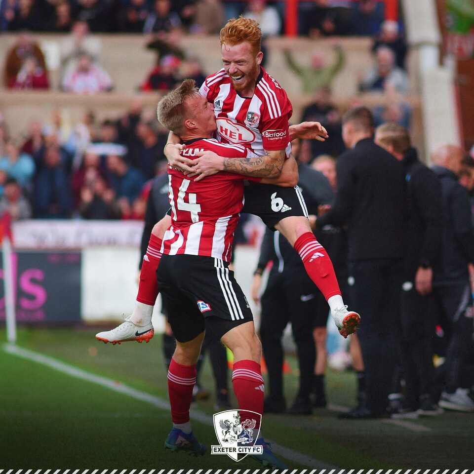 Image of Ryan Woods being held up in the air by Ilmari Niskanen after scoring