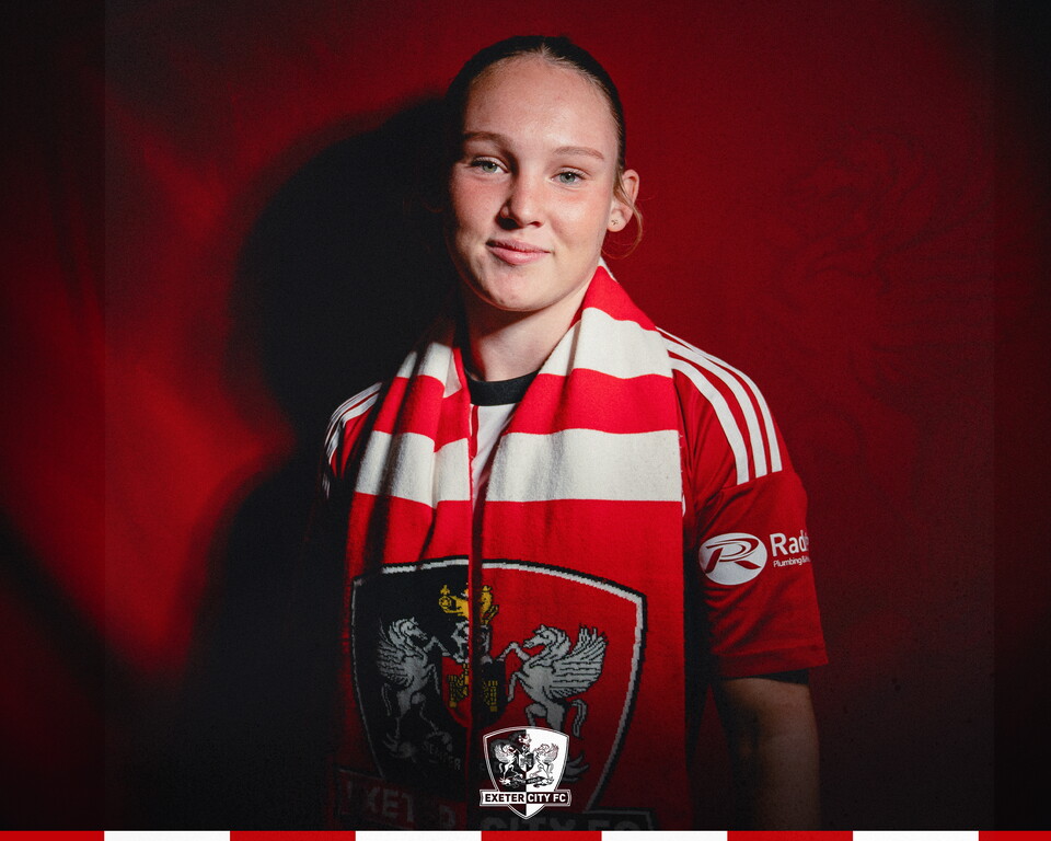 Image of Maddie Durrant, with a City scarf on, facing towards the camera