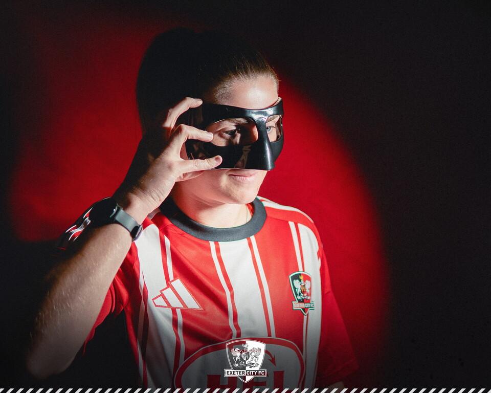 Image of Georgina Presswell holding her mask up