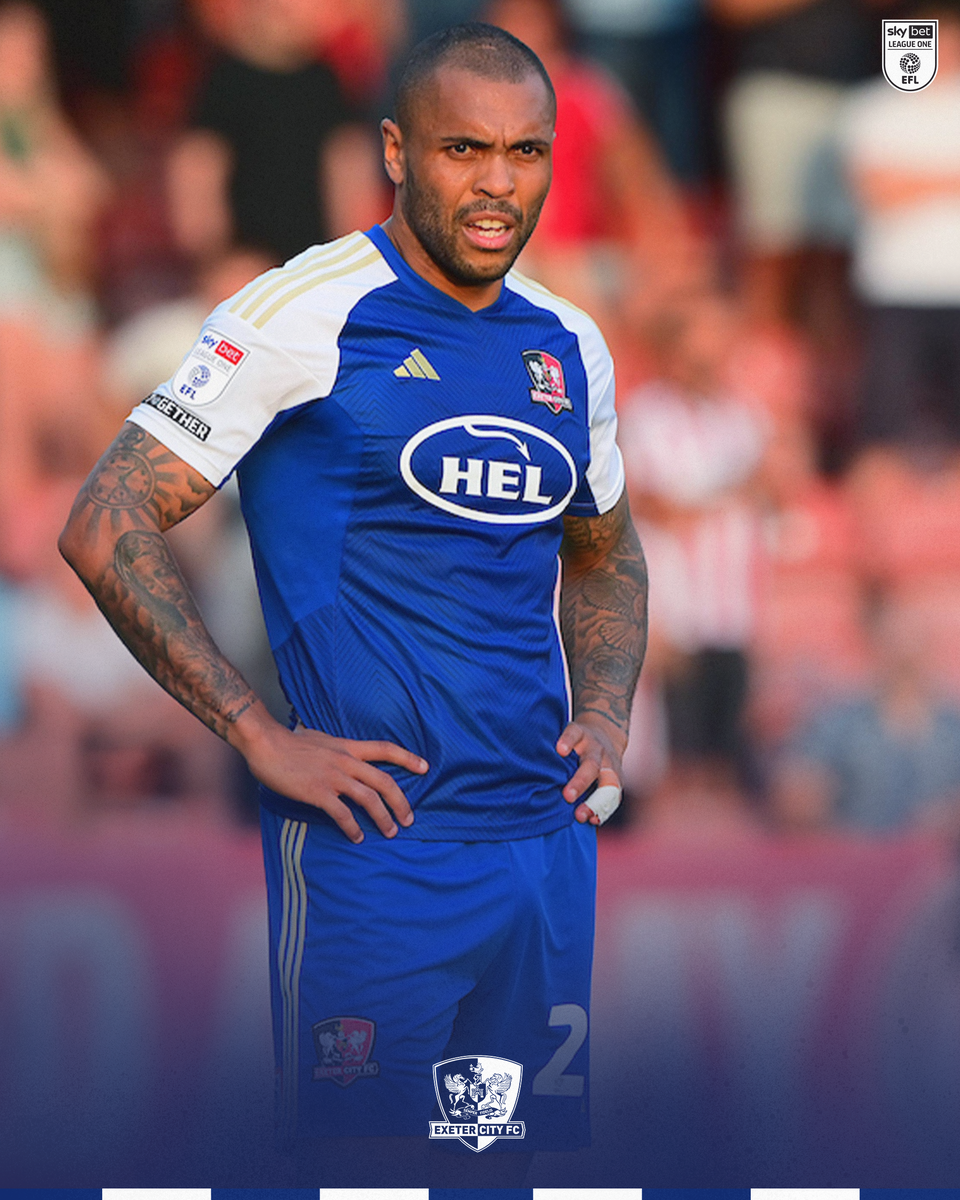 Josh Magennis wearing the blue away kit during a match
