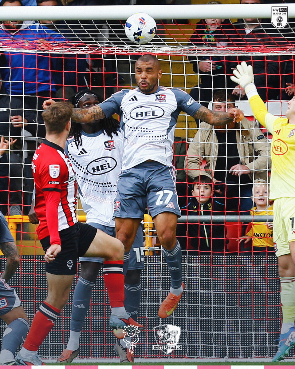 Josh Magennis heading a shot from James Collins over the crossbar