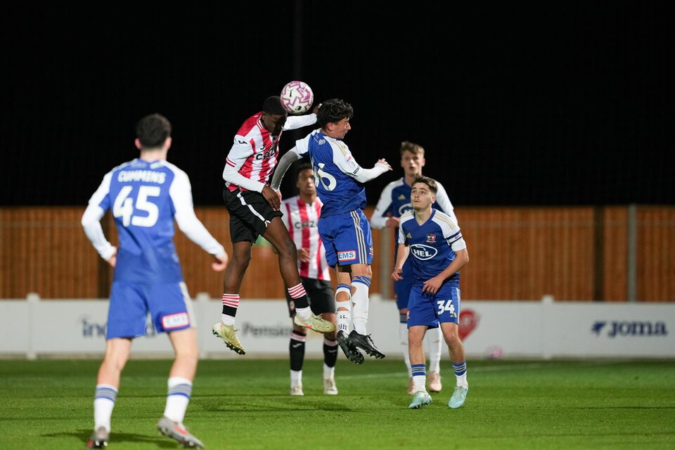 Louie Cayless battles for the ball