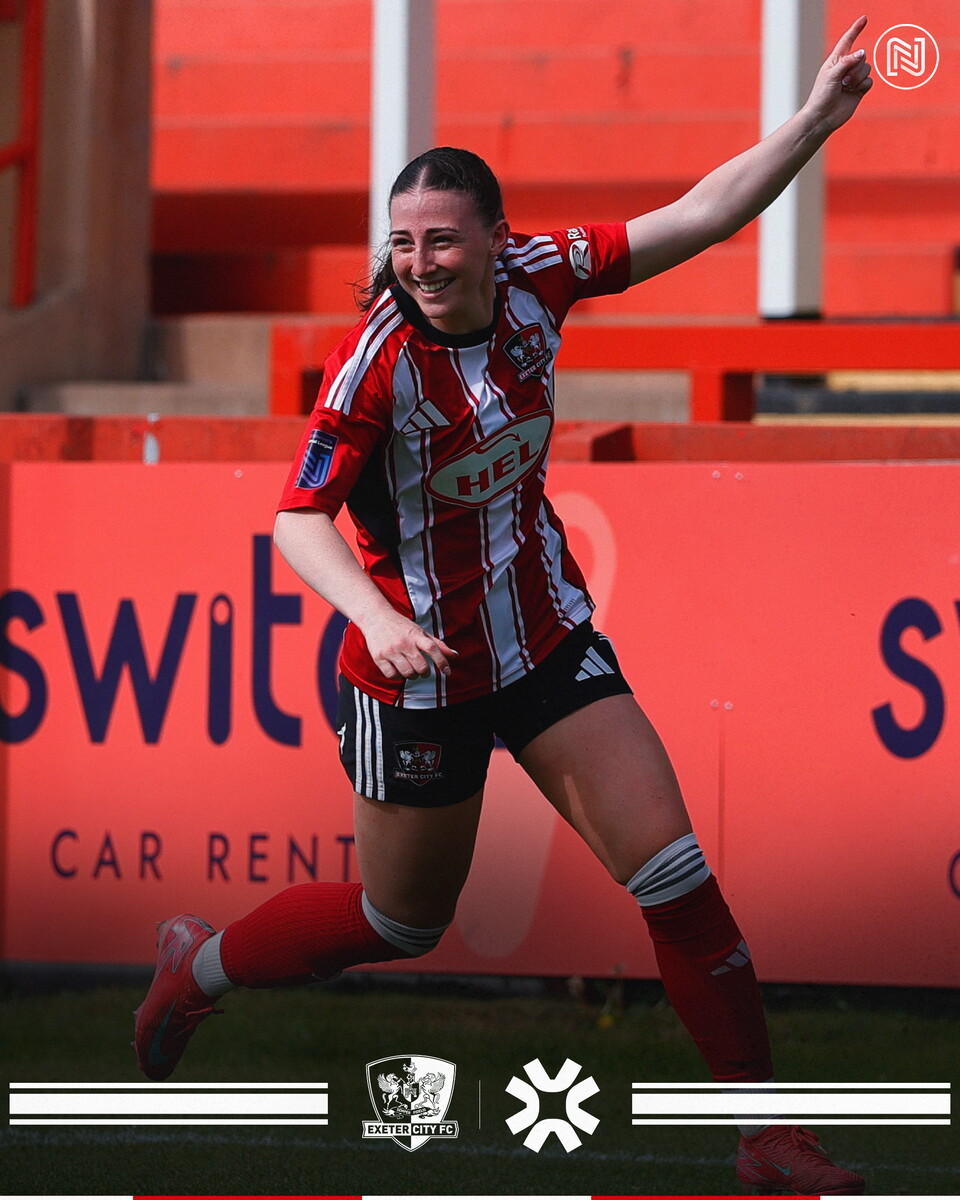 Georgia Vaccaro raising an arm in the air to celebrate her goal