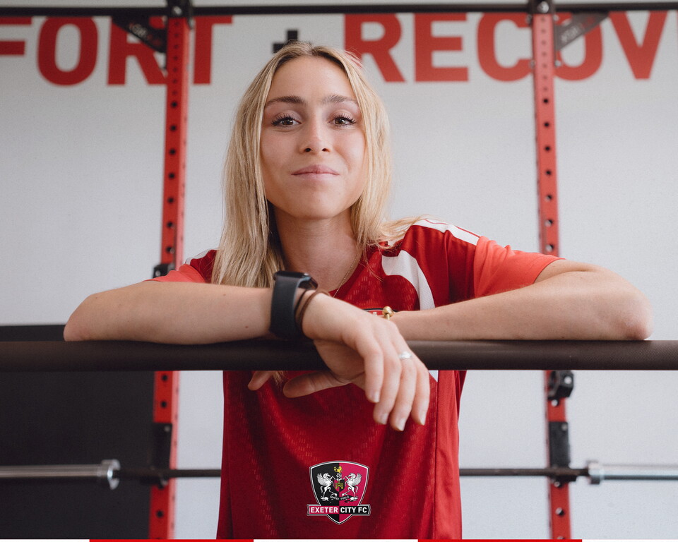 Maya Kendell leaning on a bar in City's gym at the Cliff Hill