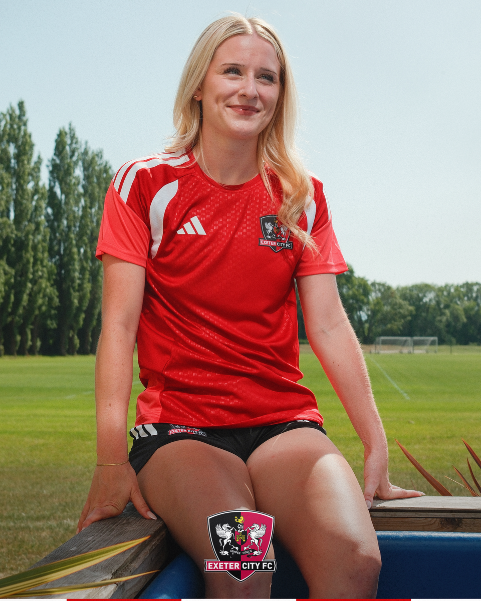Image of Tia Asker sat on the edge of the ice bath at the Cliff Hill Training Ground