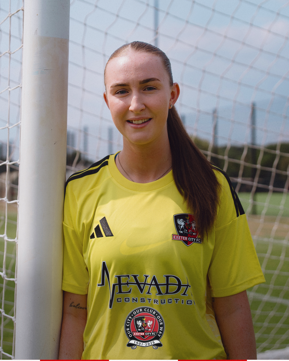 Image of Erin Foley leaning on the goalpost in her keeper kit