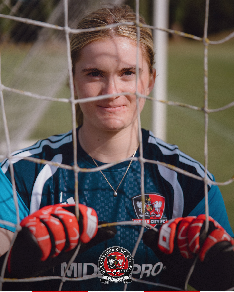 Tyrii bell with her hands going through the net at Exeter City