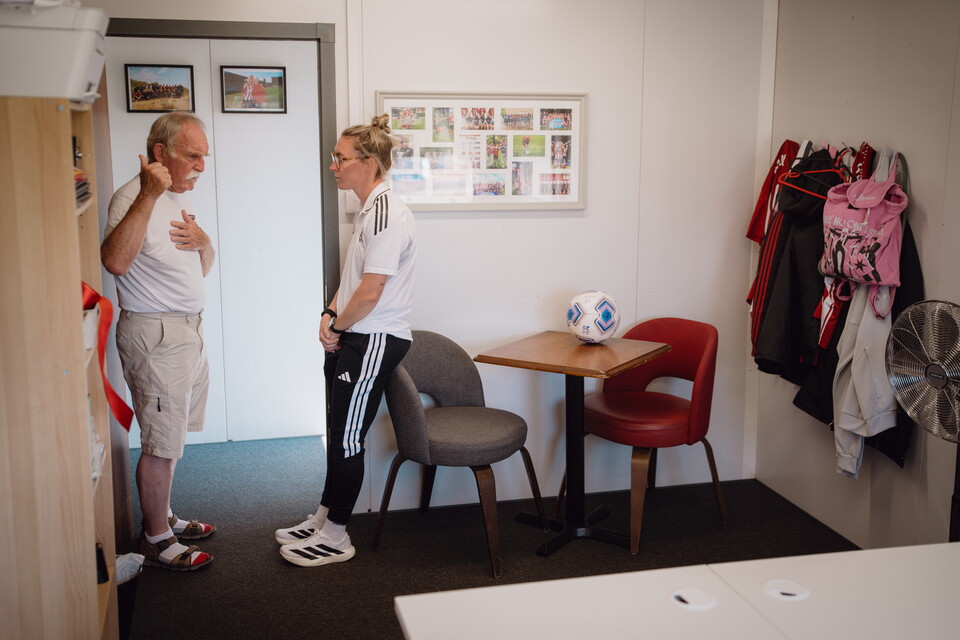 Image of Abbie Britton and a board member talking in the new women's hub