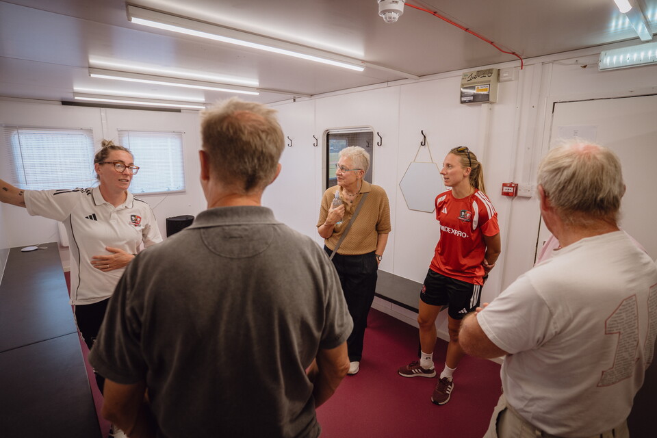 People meeting in the changing room in the new women's hub