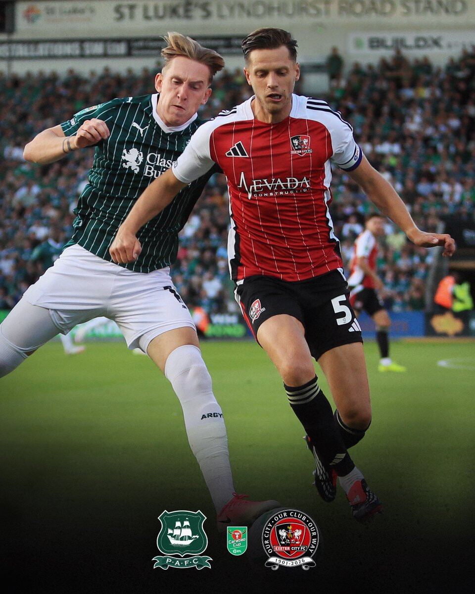 Jack Fitzwater battling for the ball with Ronan Curtis