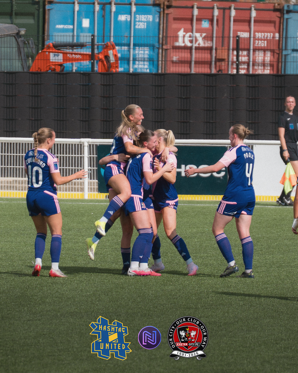 The players celebrating Nia Lewis' equaliser 