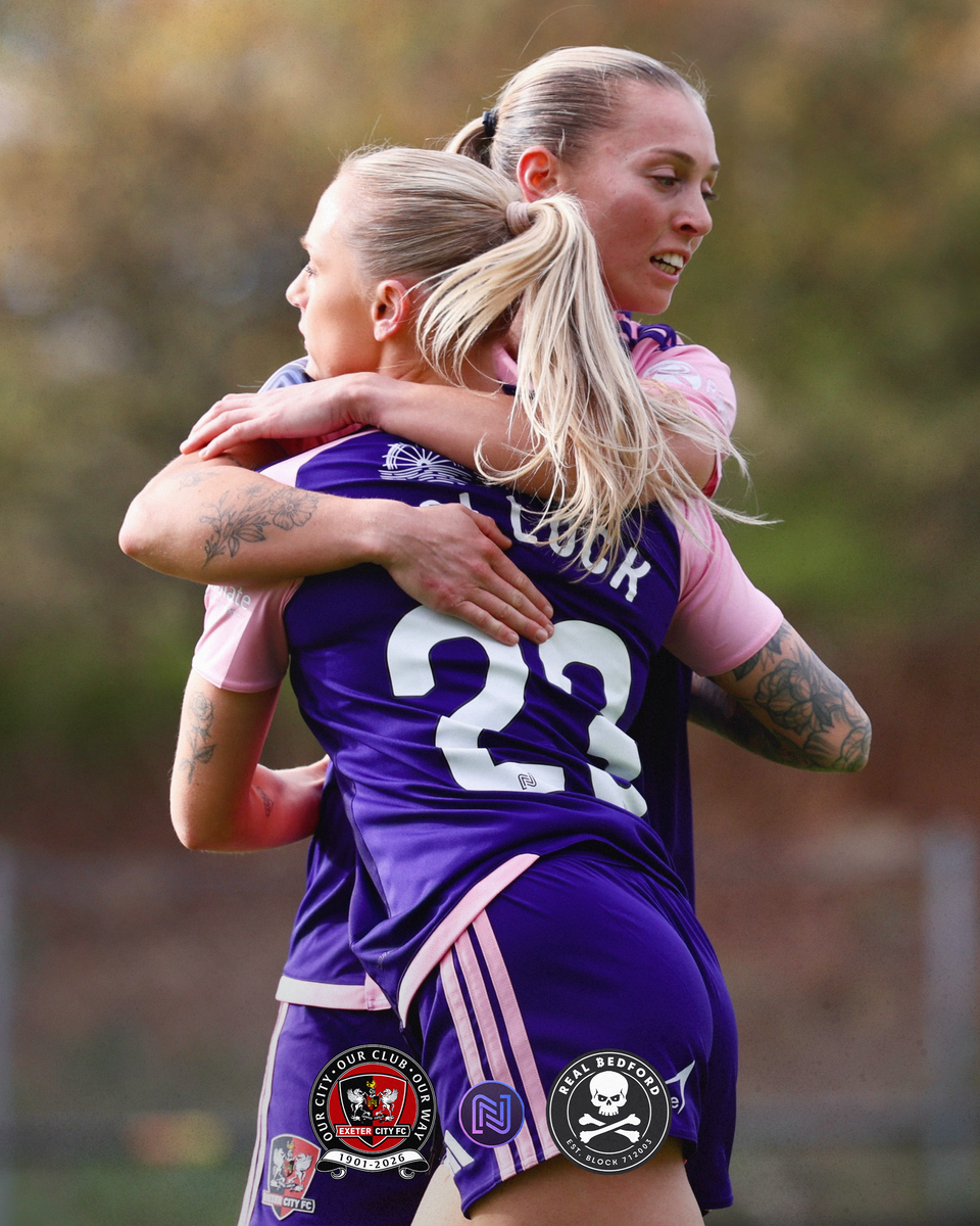 Amber Pollock celebrating her goal with Charlotte Whitmore