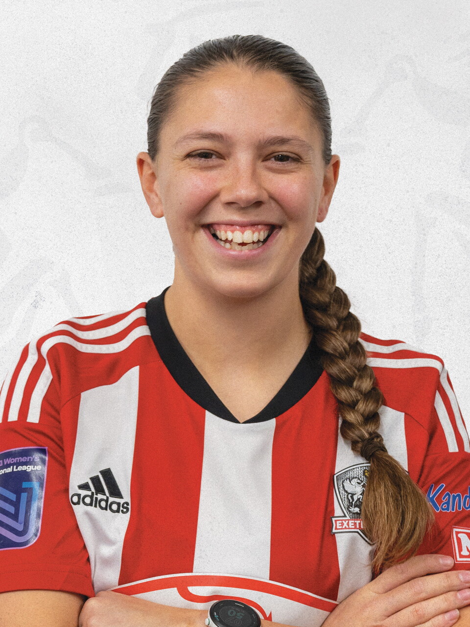 Profile image of Bronwyn Cousins, in her red and white home shirt for Exeter City Women