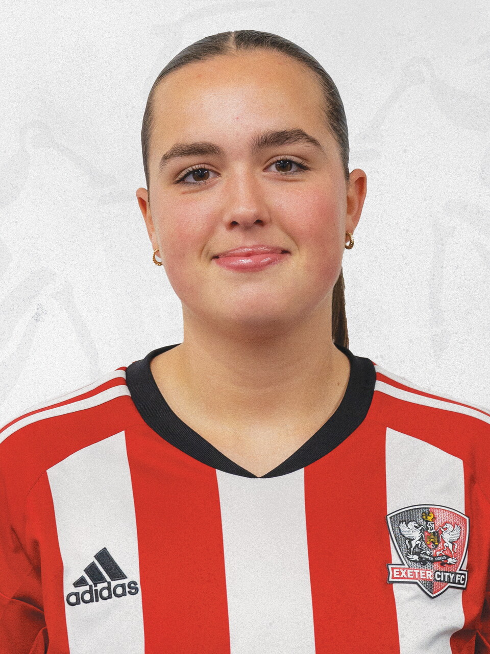 Jasmine Barker profile picture in her red and white home shirt