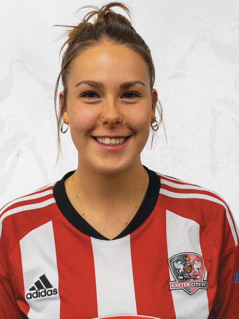 Profile picture of Maddie Brandon in her red and white home kit
