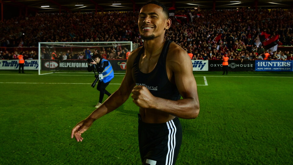 Demetri Mitchell celebrating after Exeter City's win over Luton Town