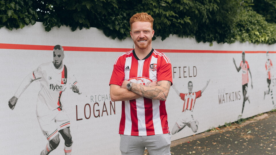 Ryan Woods in front of the ecfc strikers wall